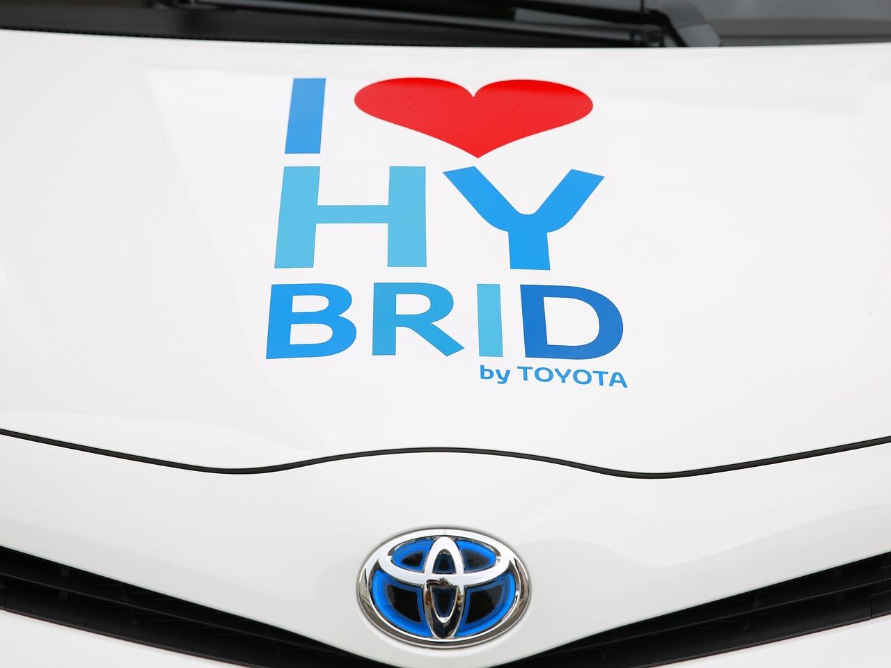 I love hybrid by Toyota on hood of hybrid vehicle